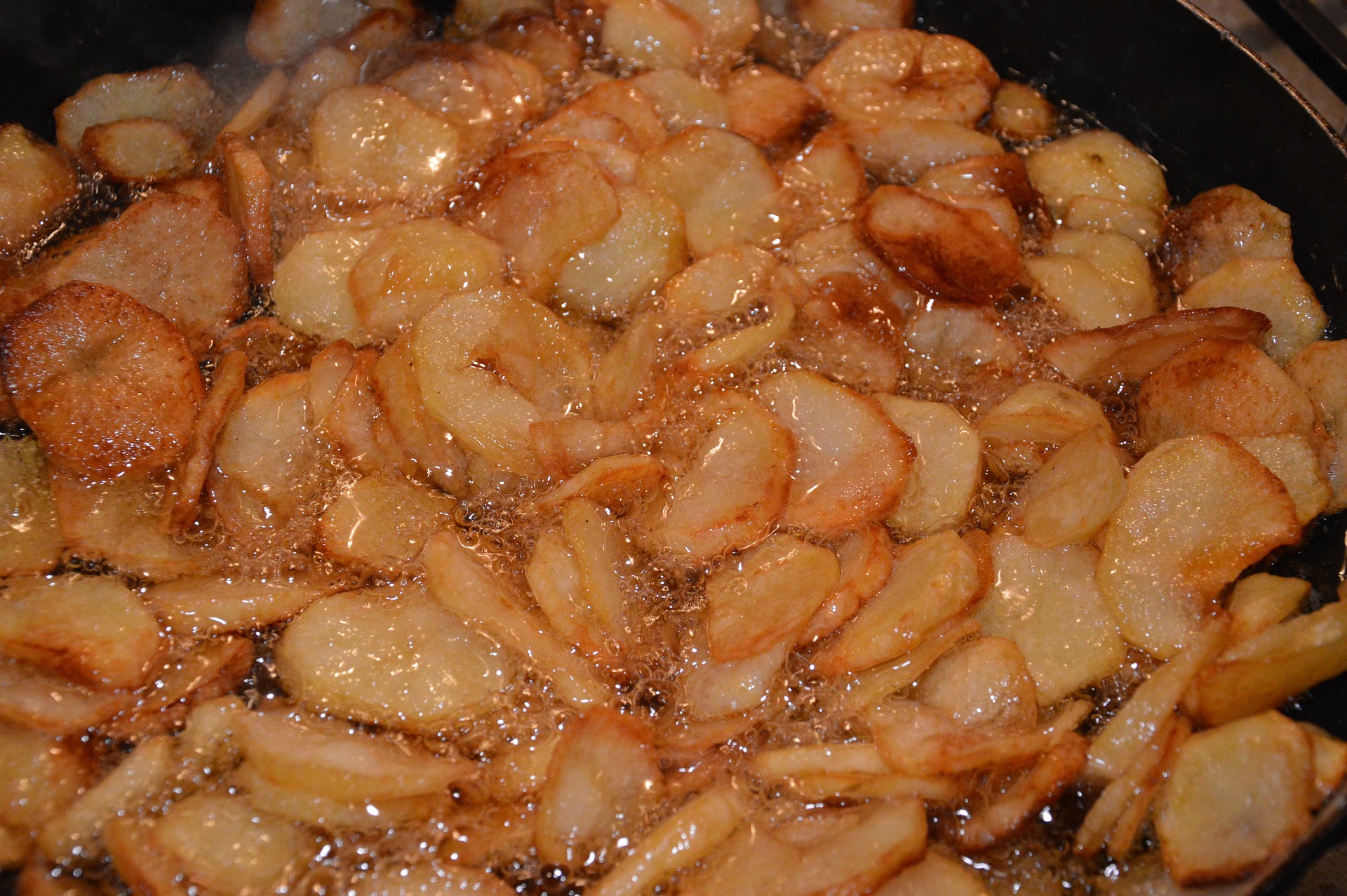 Golden crispy Pommes Soufflées on a plate